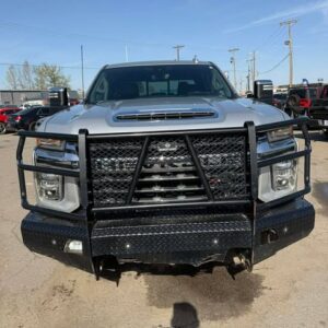 Front view of a rugged black pickup truck with a heavy-duty grille guard.