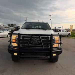 White pickup truck with heavy grille guard